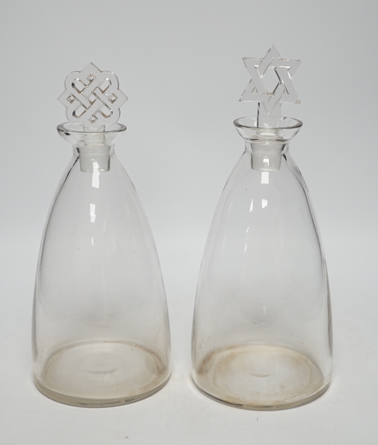 Two R. Lalique decanters, one with a Celtic knot stopper, the other the Star of David, tallest 27cm high (mark to base)